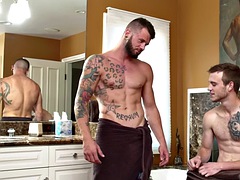 Tattooed jock sucks and rides muscular top until she squirts with cum