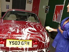 Gorgeous babes washing a car together and masturbating with toys