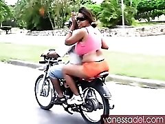 Huge tits girl on the back of a motorcycle