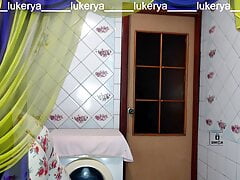 Hot housewife Lukerya in red lingerie with her erotic fantasies in the kitchen in front of fans on the webcam online.