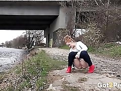 Redhead by the river takes a hot piss